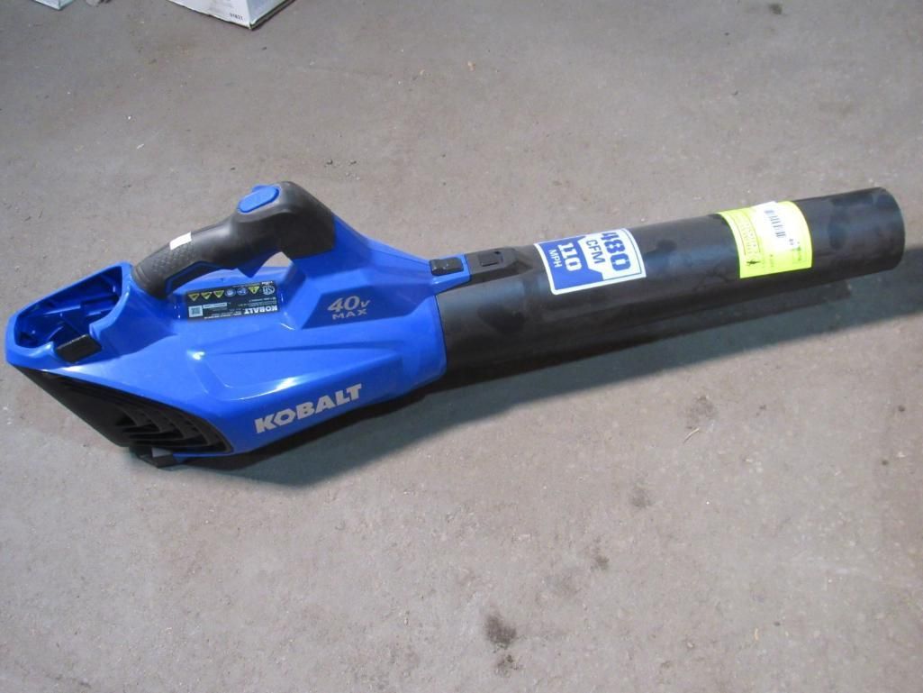 Blue and black Kobalt cordless leaf blower on a concrete surface.