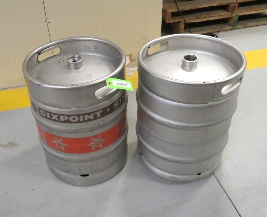 Two silver beer kegs side-by-side; one with a red