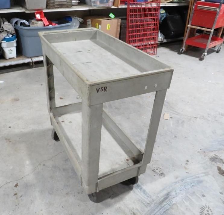 Gray utility cart on wheels, rectangular with a raised rim.