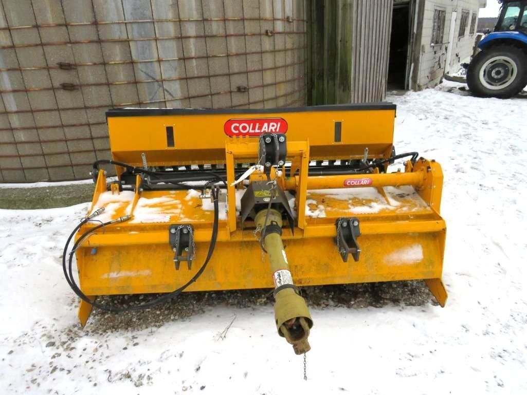 Yellow Collari rotary tiller on snow.