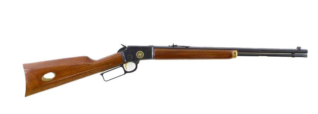 A brown and black lever-action rifle on a white background.