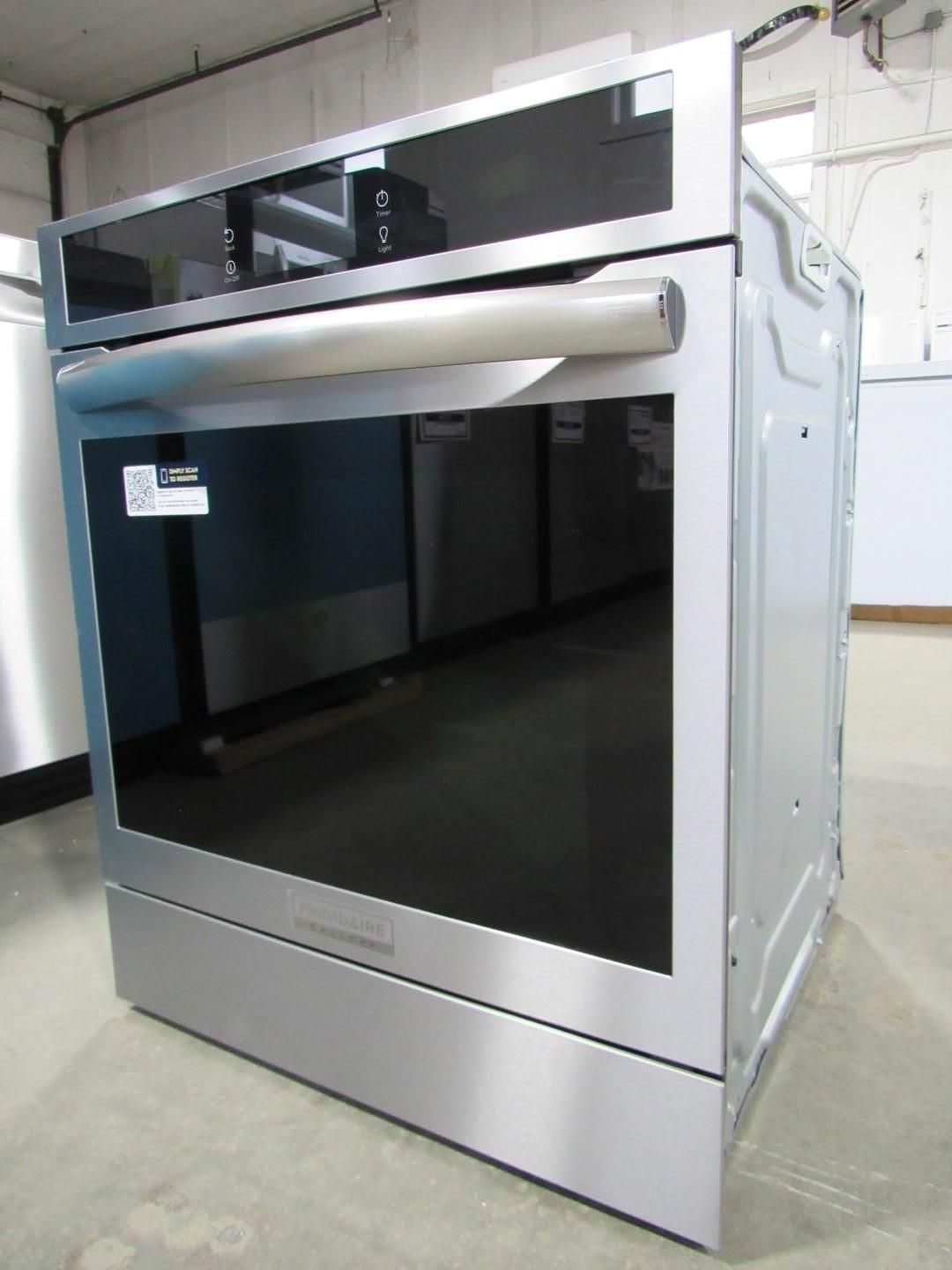 Stainless steel wall oven with a black glass door and control panel above.