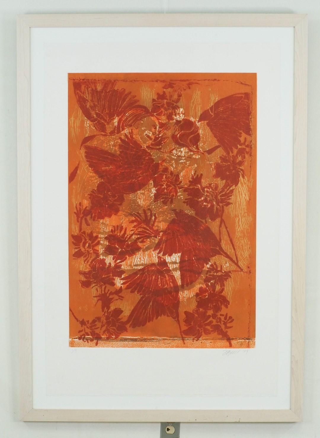 Orange and white print of leaves and floral elements in a vertical wooden frame.