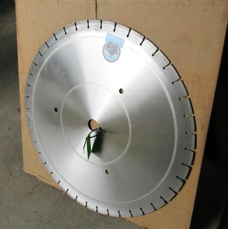 Large circular saw blade with segmented cutting edge, resting in a cardboard box.