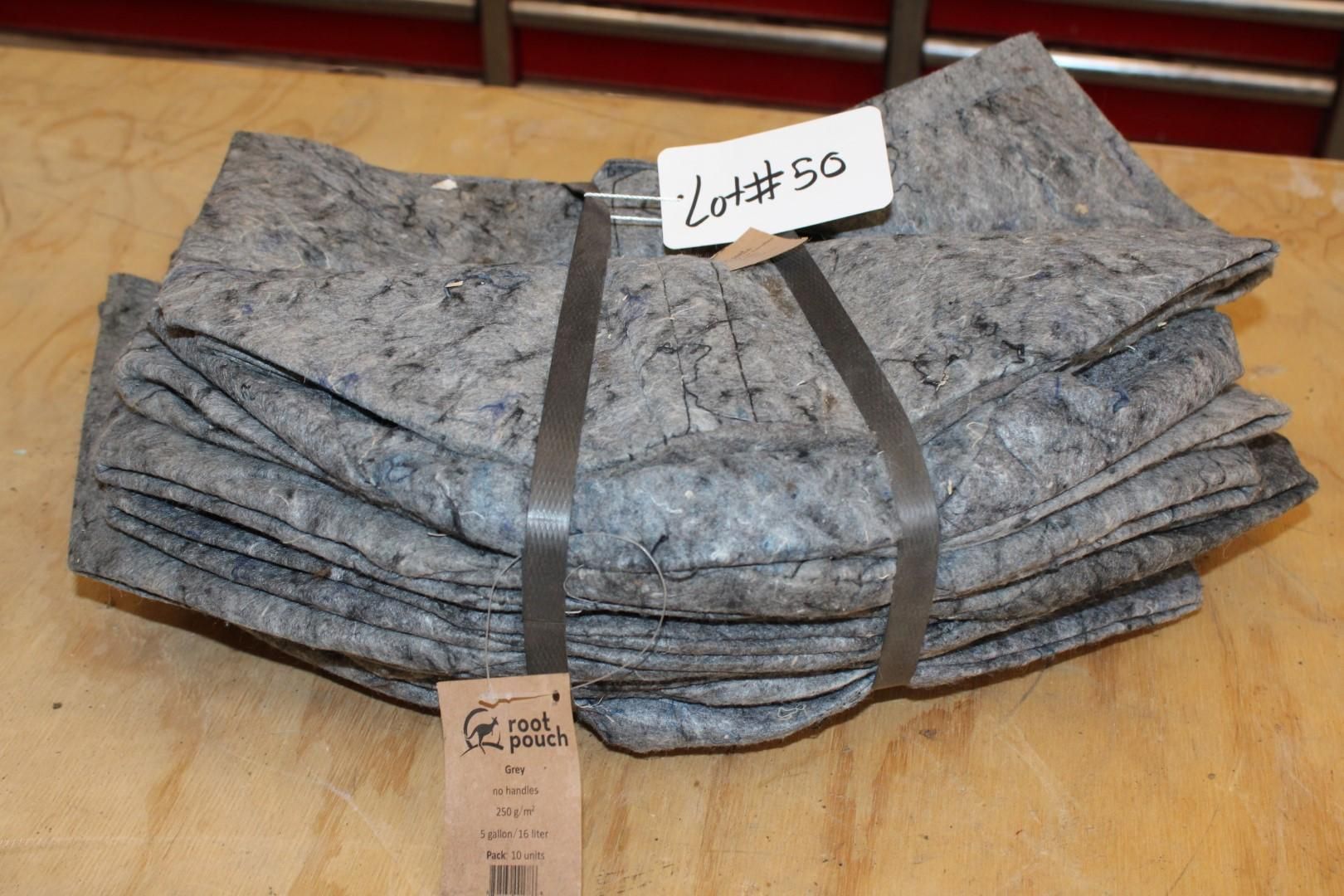 Bundle of grey oil absorbent pads, bound with straps, labeled