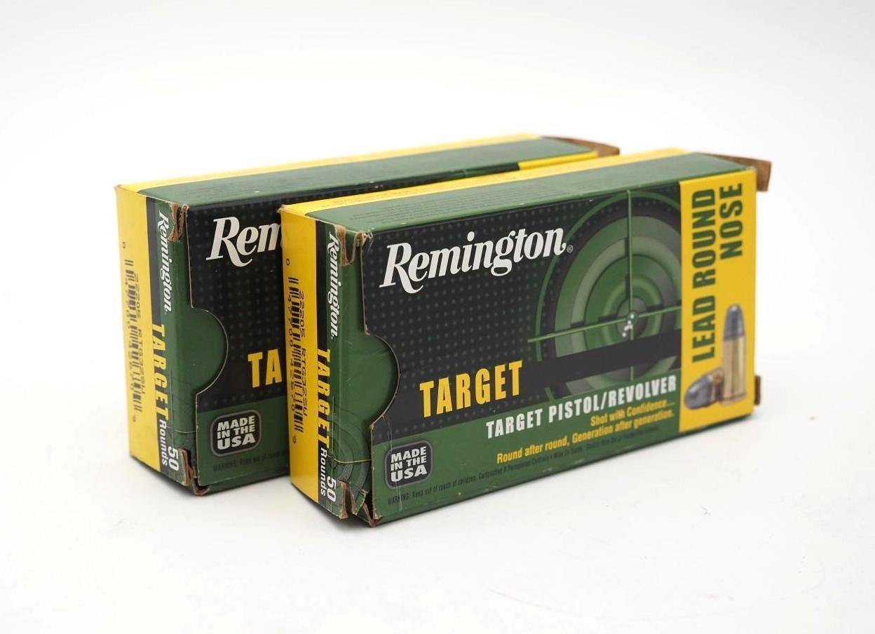 Two Remington Target 12-gauge shotgun shell boxes, green and yellow, stacked on a white background