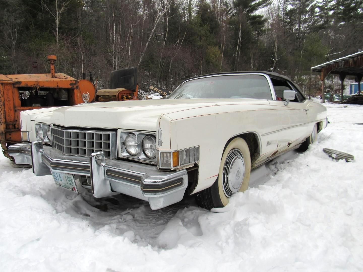 White vintage Cadillac.