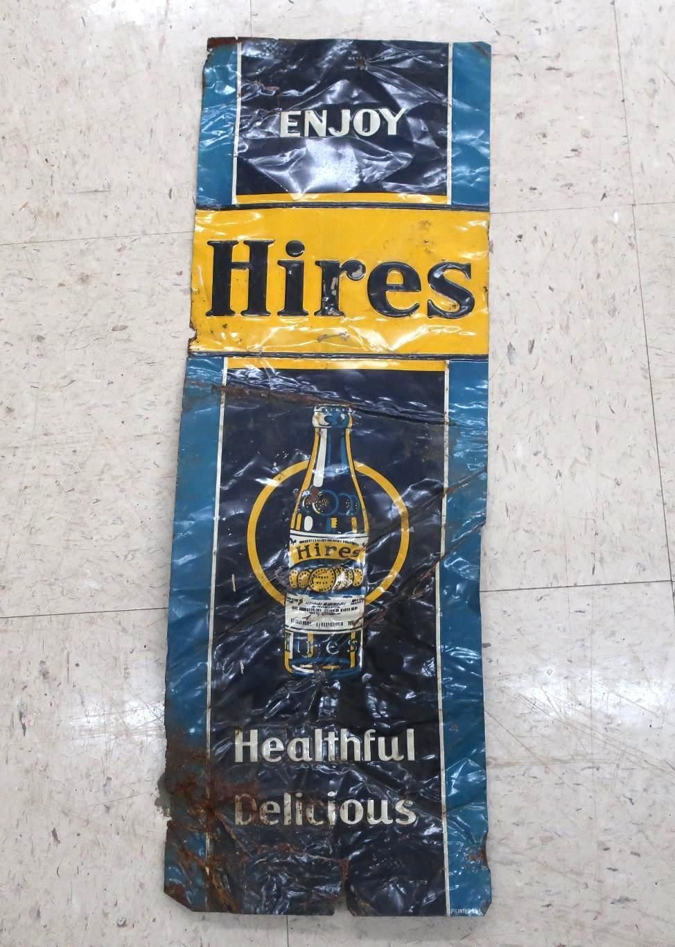 Hires Root Beer sign, blue and yellow, with a bottle graphic.