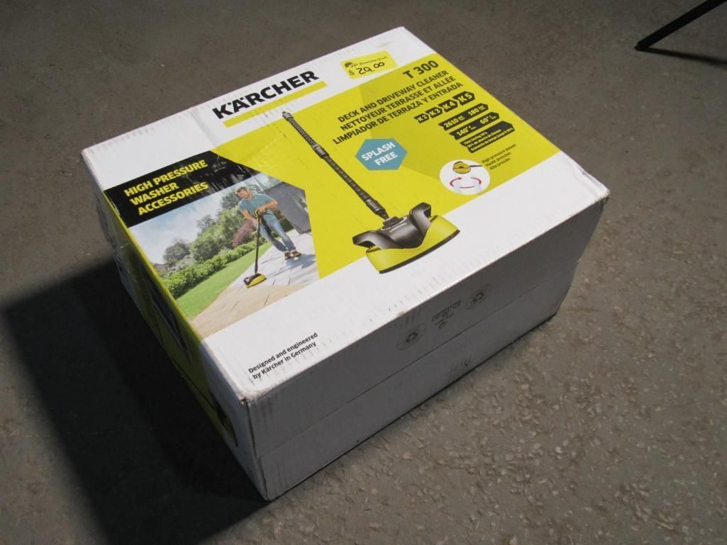 Kärcher box on a concrete floor. The box displays an image of a cleaning device and has yellow accents.