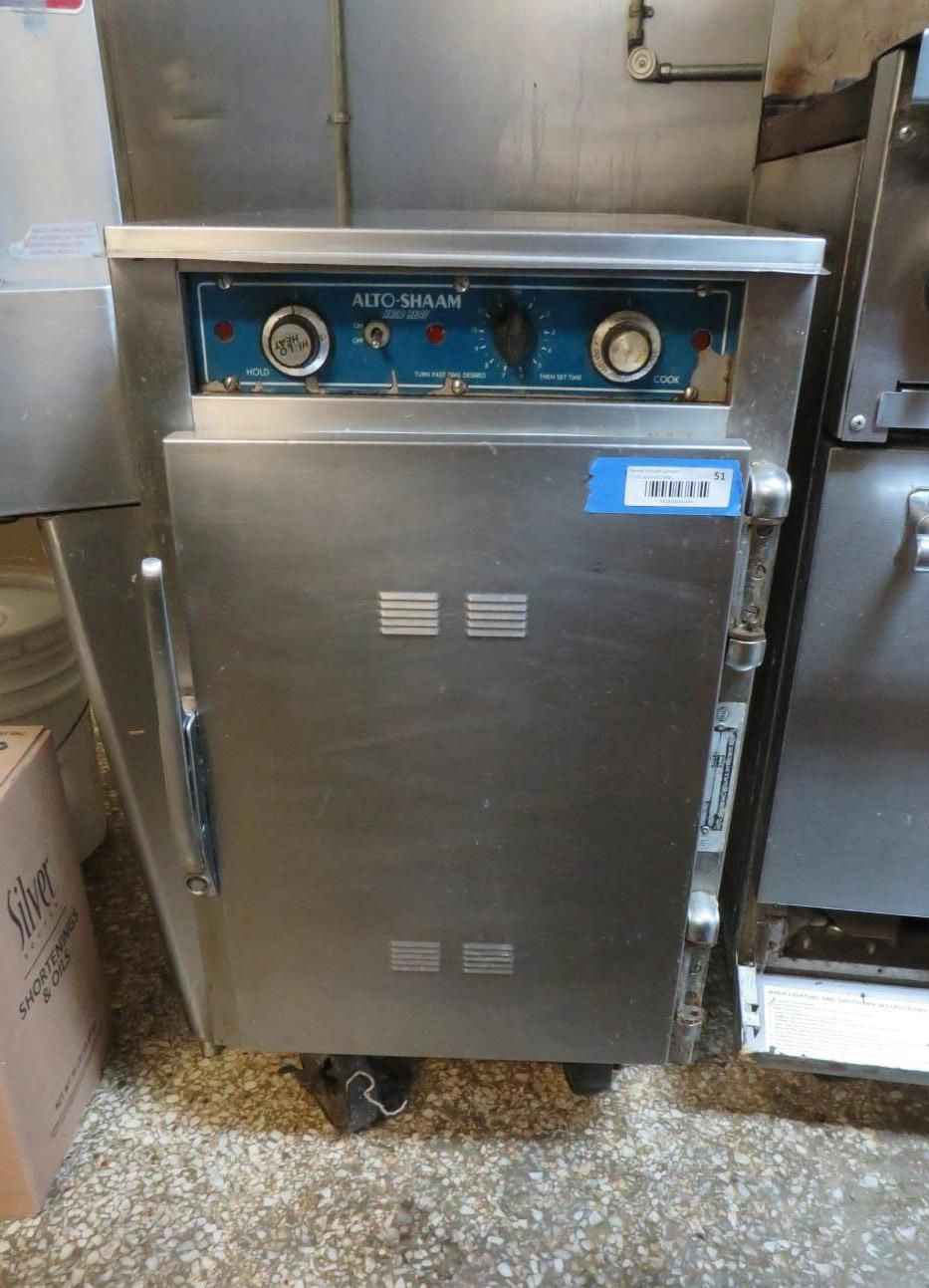 Commercial food warmer with stainless steel exterior and control panel.
