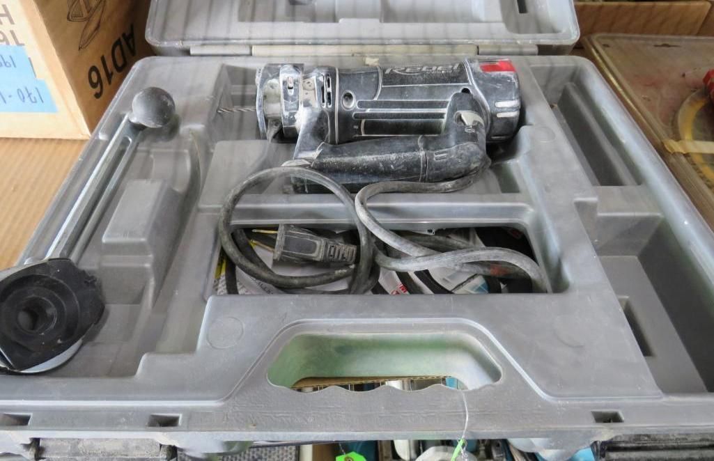 Power tool in a gray case with accessories.