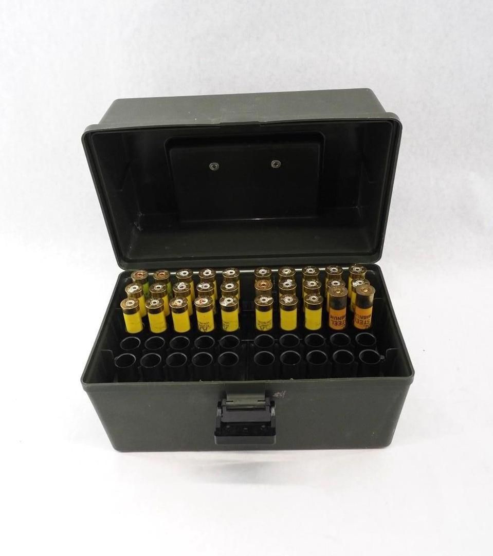 Black carrying case open with rows of small yellow-capped vials inside