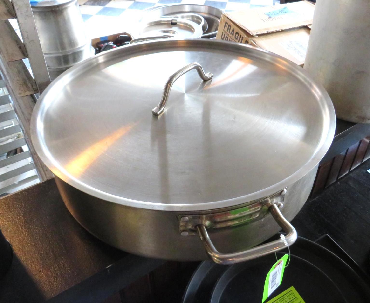 Stainless steel pot with lid and handles.