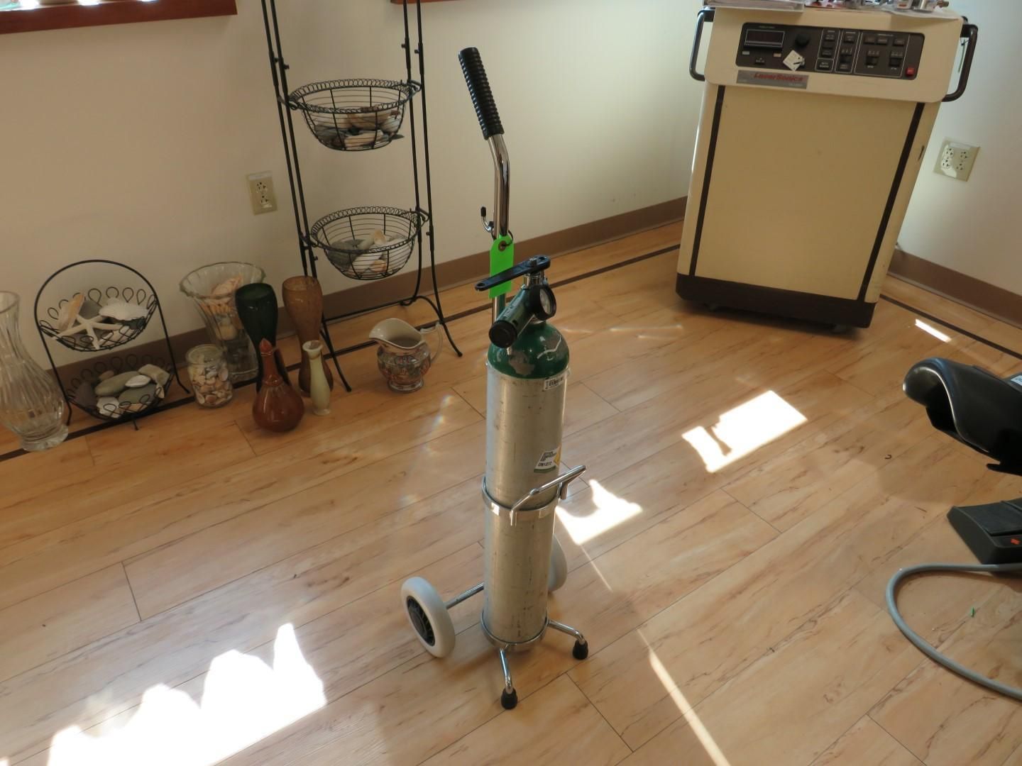 Oxygen tank on wheels.