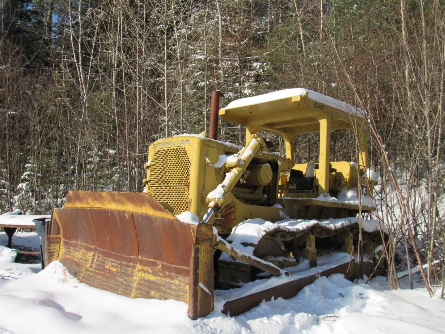 Caterpillar D7 Bulldozer covered in snow.