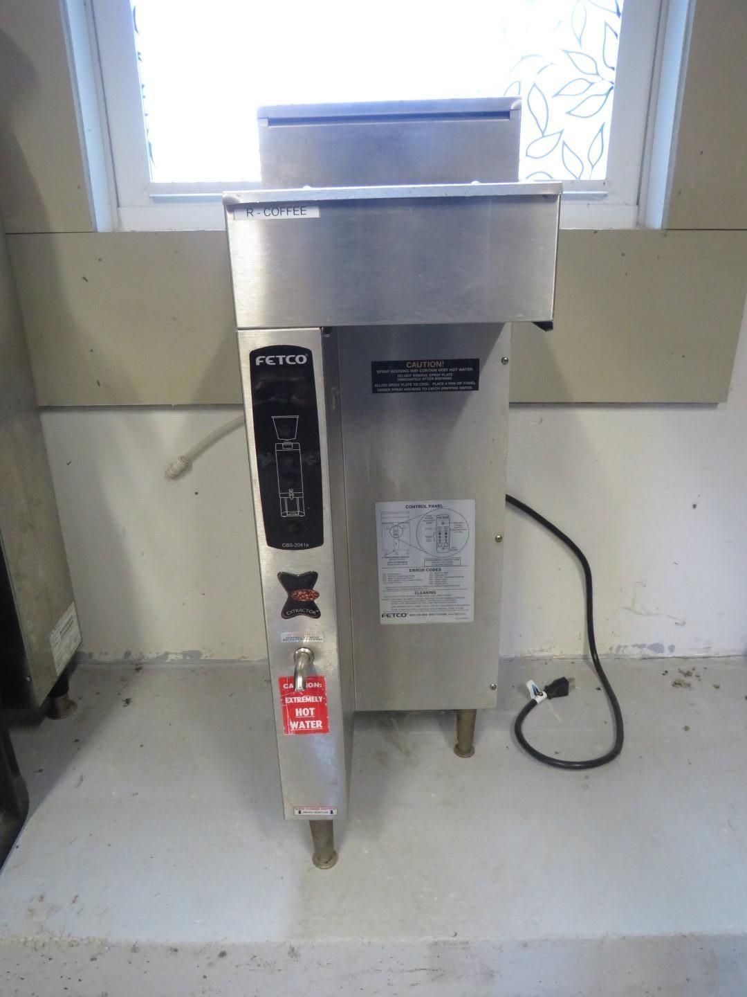 Stainless steel Frymaster fryer with control panel and power cord in a room.