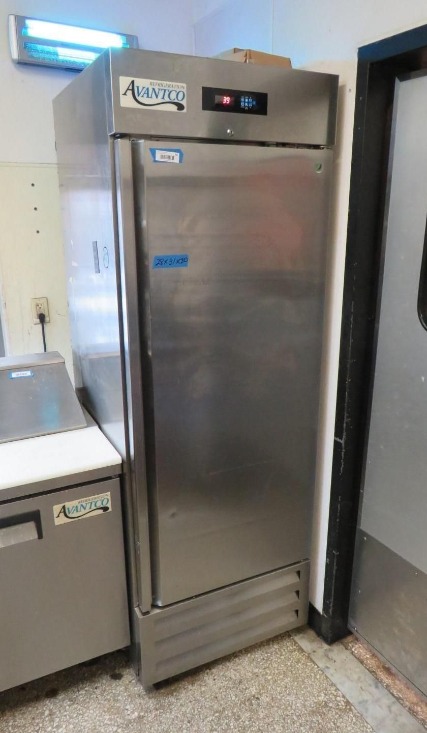 Stainless steel commercial refrigerator in a kitchen.