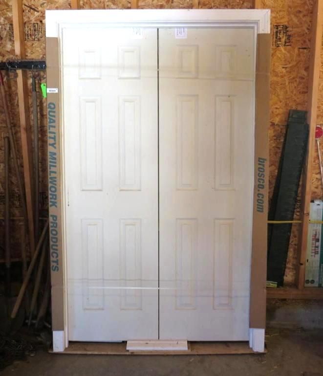 White double doors, framed, in a wood-paneled room.