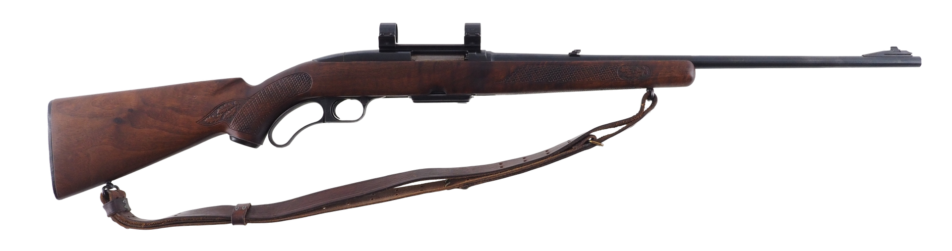 A brown rifle with a scope and a brown leather strap.