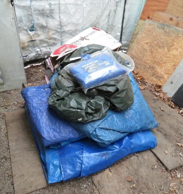 Blue tarps and bags.