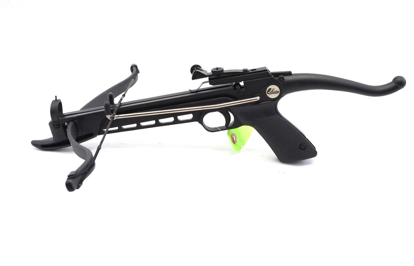 Black crossbow with scope and loaded bolt on white background