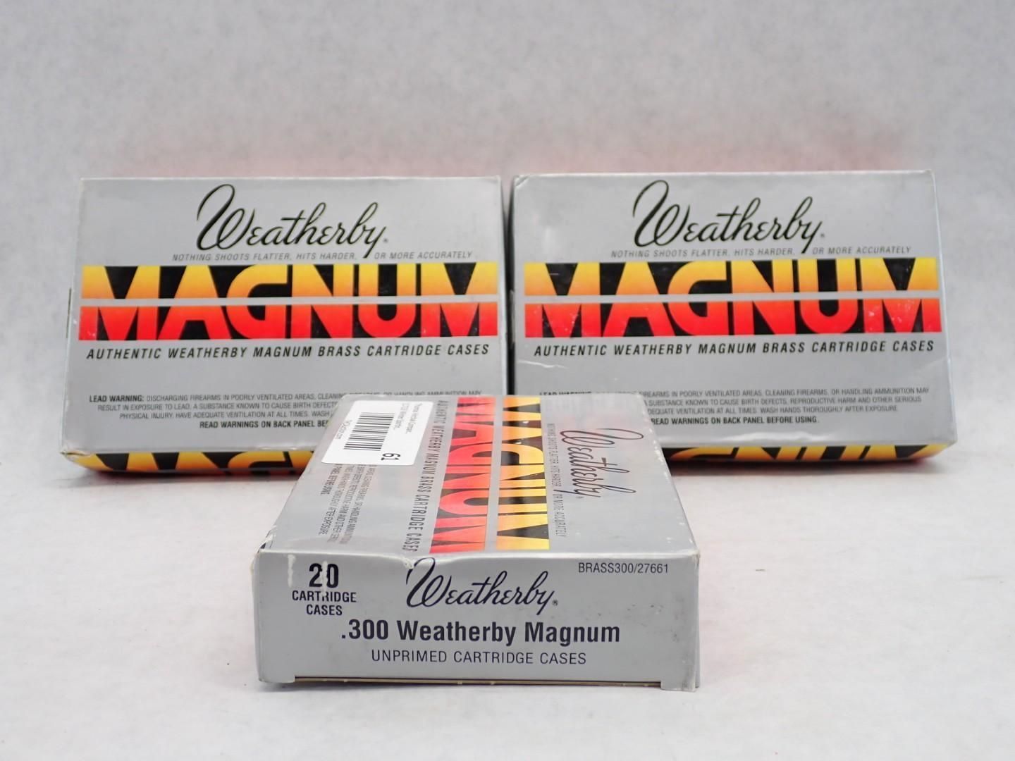 Three boxes of Weatherby .300 Magnum ammunition against a white background. Gray, yellow, and red color scheme.