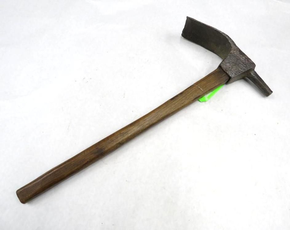 A pickaxe with a wooden handle, and a curved, metal blade head.