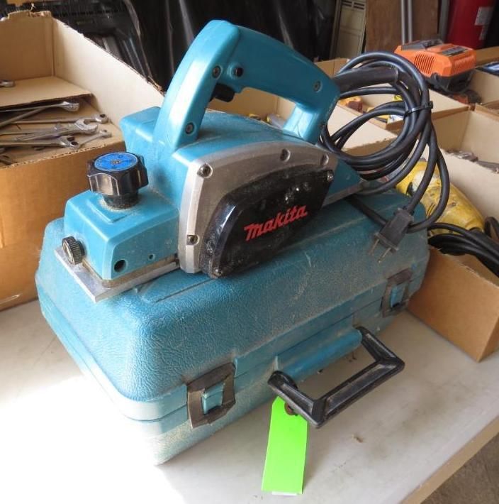 Blue Makita power planer with black handle and case.