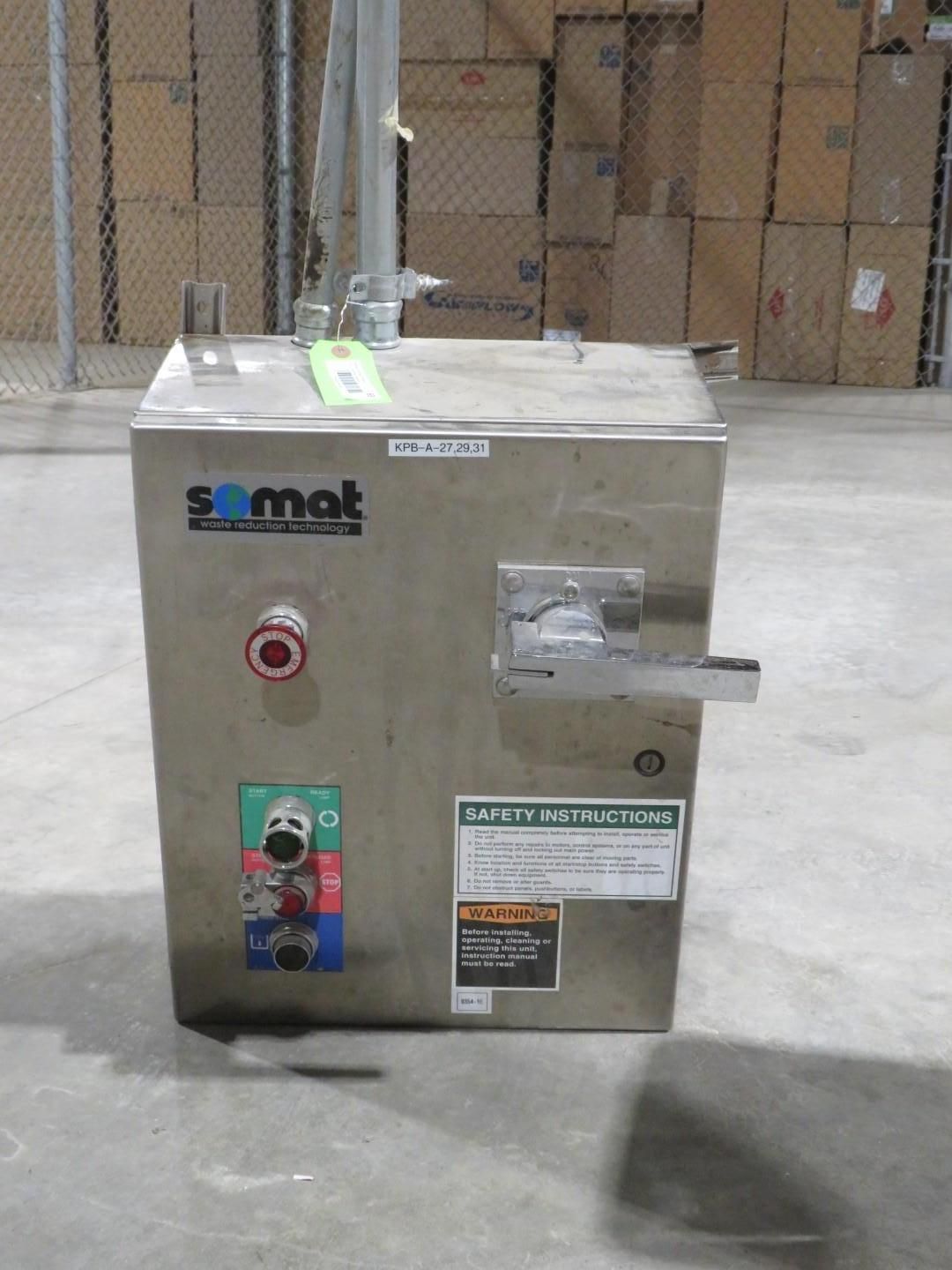 Stainless steel industrial machine with control panel and attached piping.