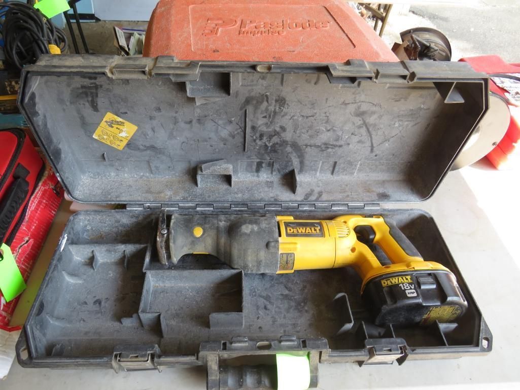 Yellow and black DeWalt reciprocating saw in a black plastic case.
