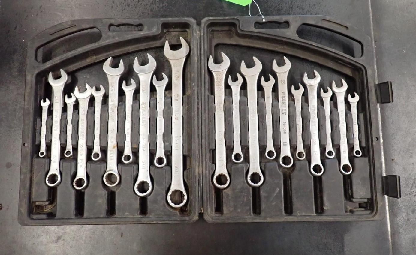 Open wrench set in a black plastic case. Wrenches are silver.