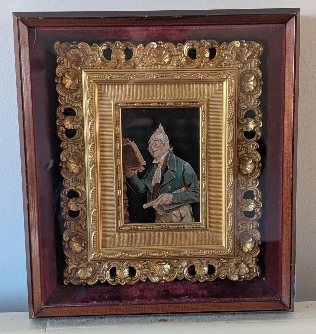 Framed miniature portrait in an ornate gold frame within a larger wooden frame