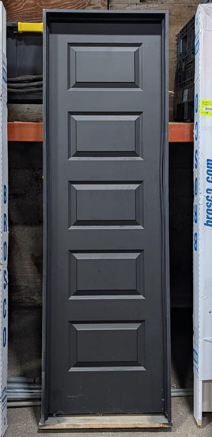 Dark gray paneled closet door standing upright in a store display area