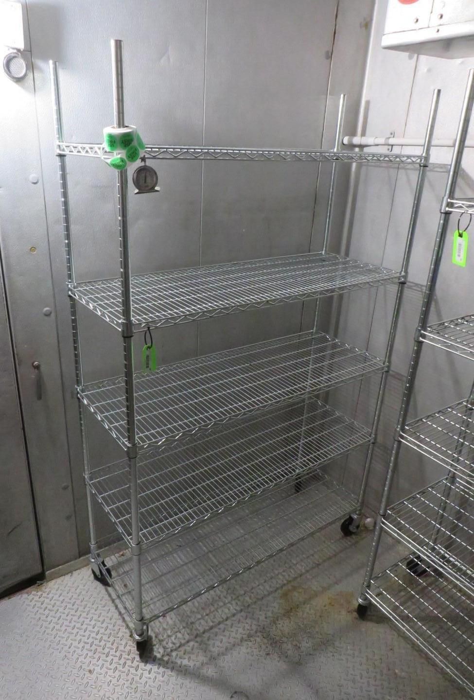 Metal wire shelving unit in a cold storage room.