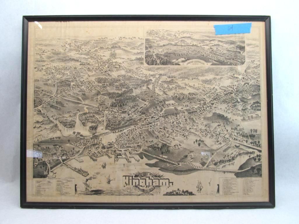 Black and white framed map, aerial view of a town or city, with water at the bottom, and a smaller inset map.
