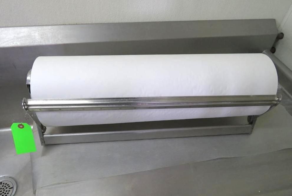 Paper towel roll in a stainless steel dispenser.