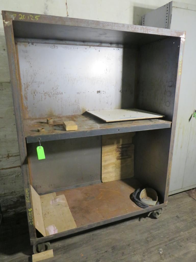 Metal shelving unit with two shelves. Rolls on casters.