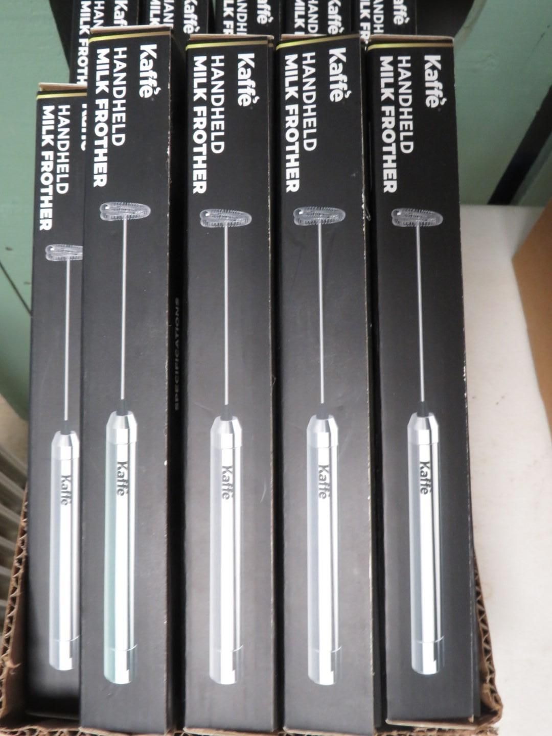 Five black boxes of Kaffe handheld milk frothers, silver color.