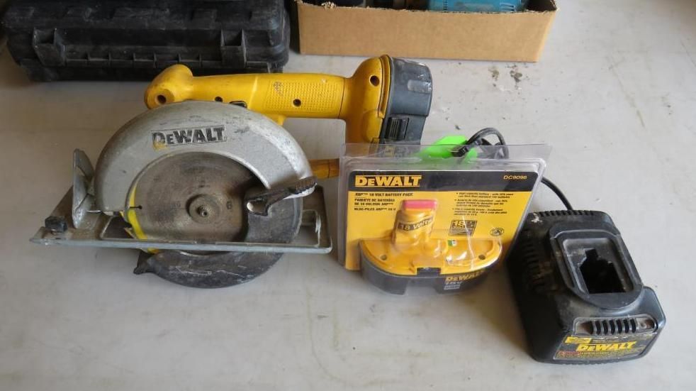 Yellow DeWalt circular saw, battery, and charger on a surface.