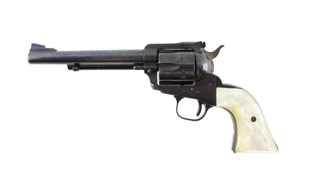 Black revolver with mother-of-pearl grip against a white background.