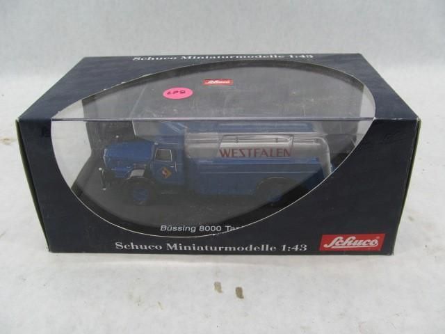 A blue Schuco model truck with