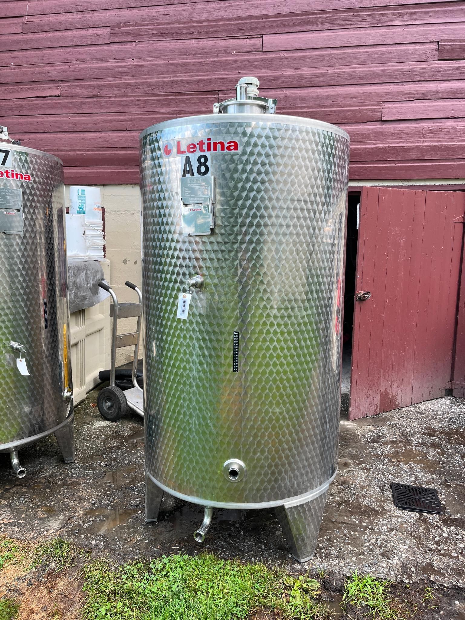 Stainless steel wine tank labeled