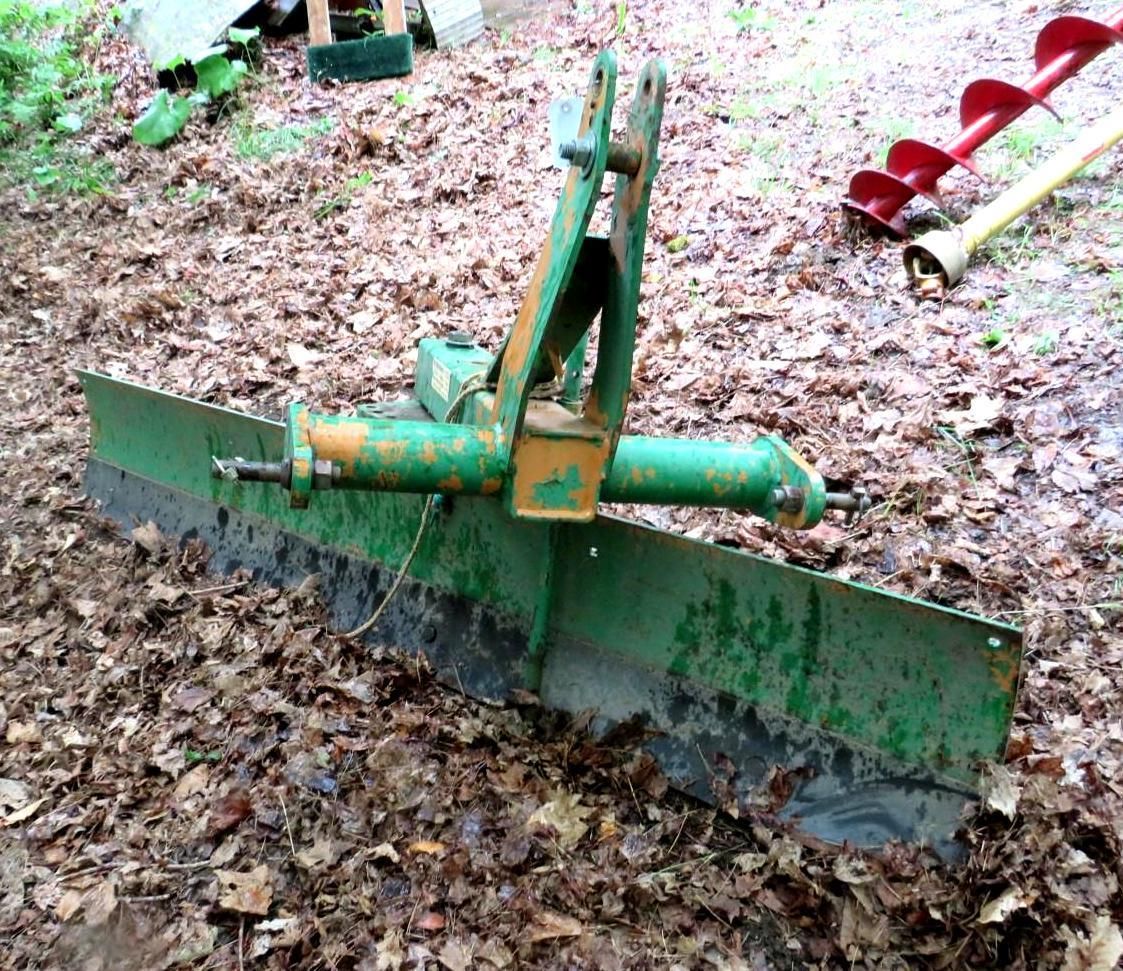 Green and yellow tractor blade.
