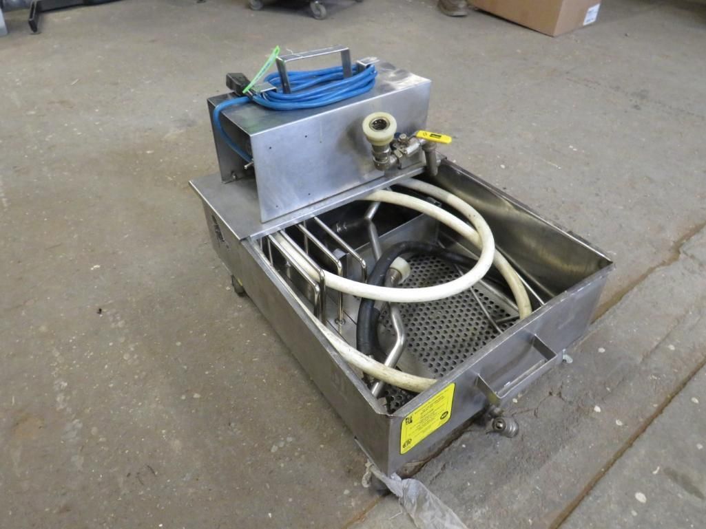 Stainless steel parts washer with hoses and a mesh basket.
