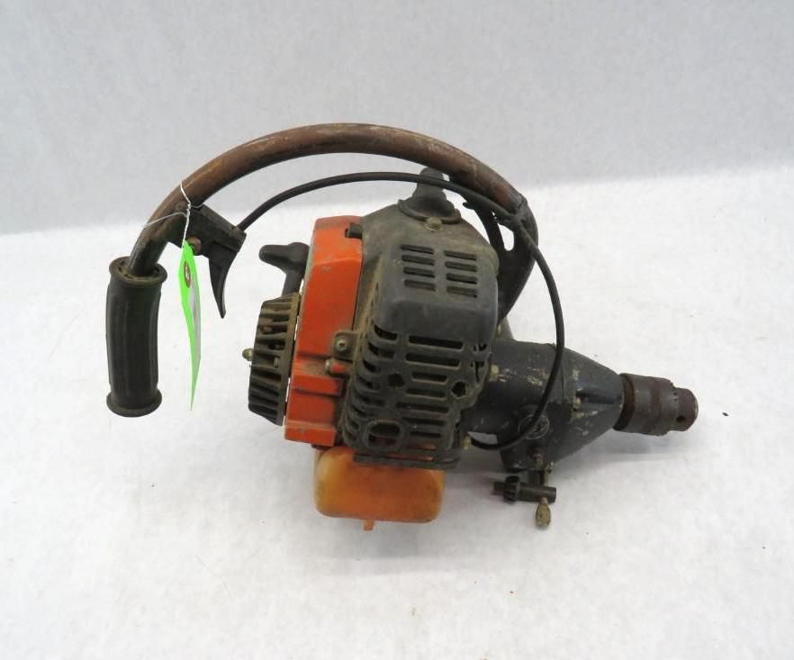 Orange and black handheld string trimmer with handle and fuel tank.