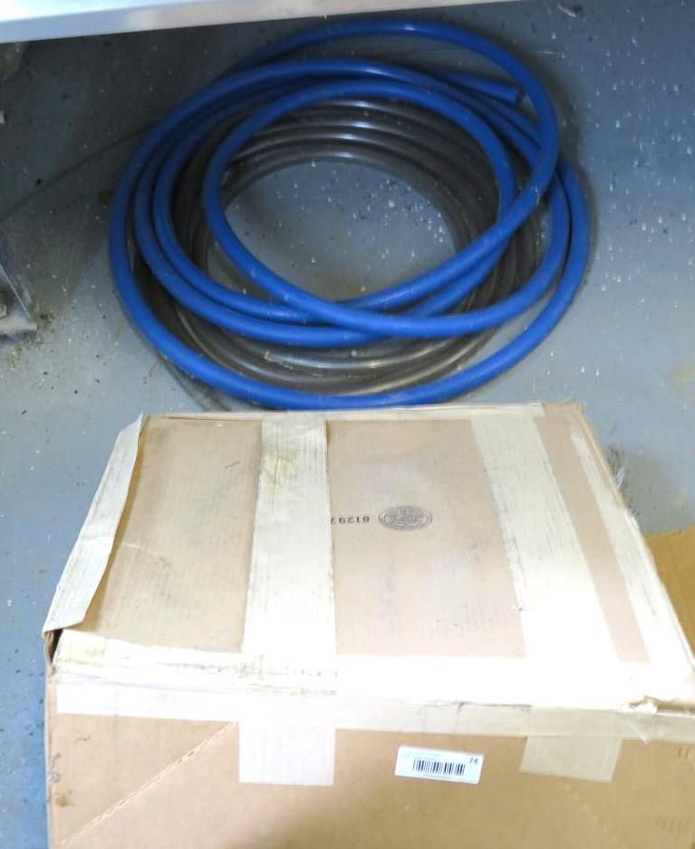 Coiled blue and gray hoses.