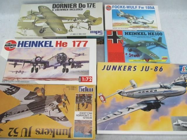 Model airplane boxes: Dornier, Focke-Wulf, Heinkel, and Junkers. World War II era aircraft.