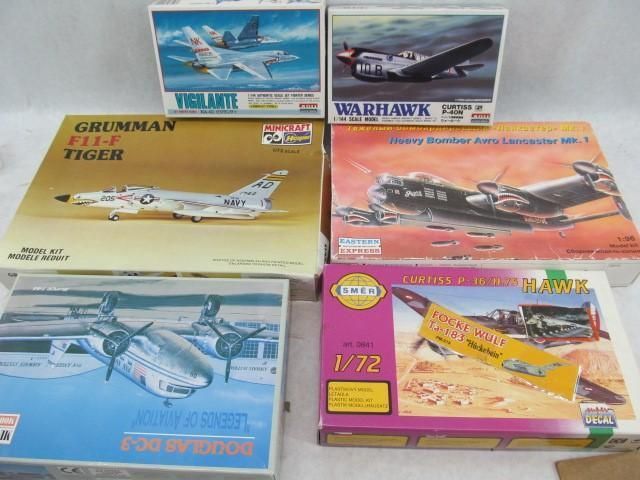 Six airplane model kit boxes: