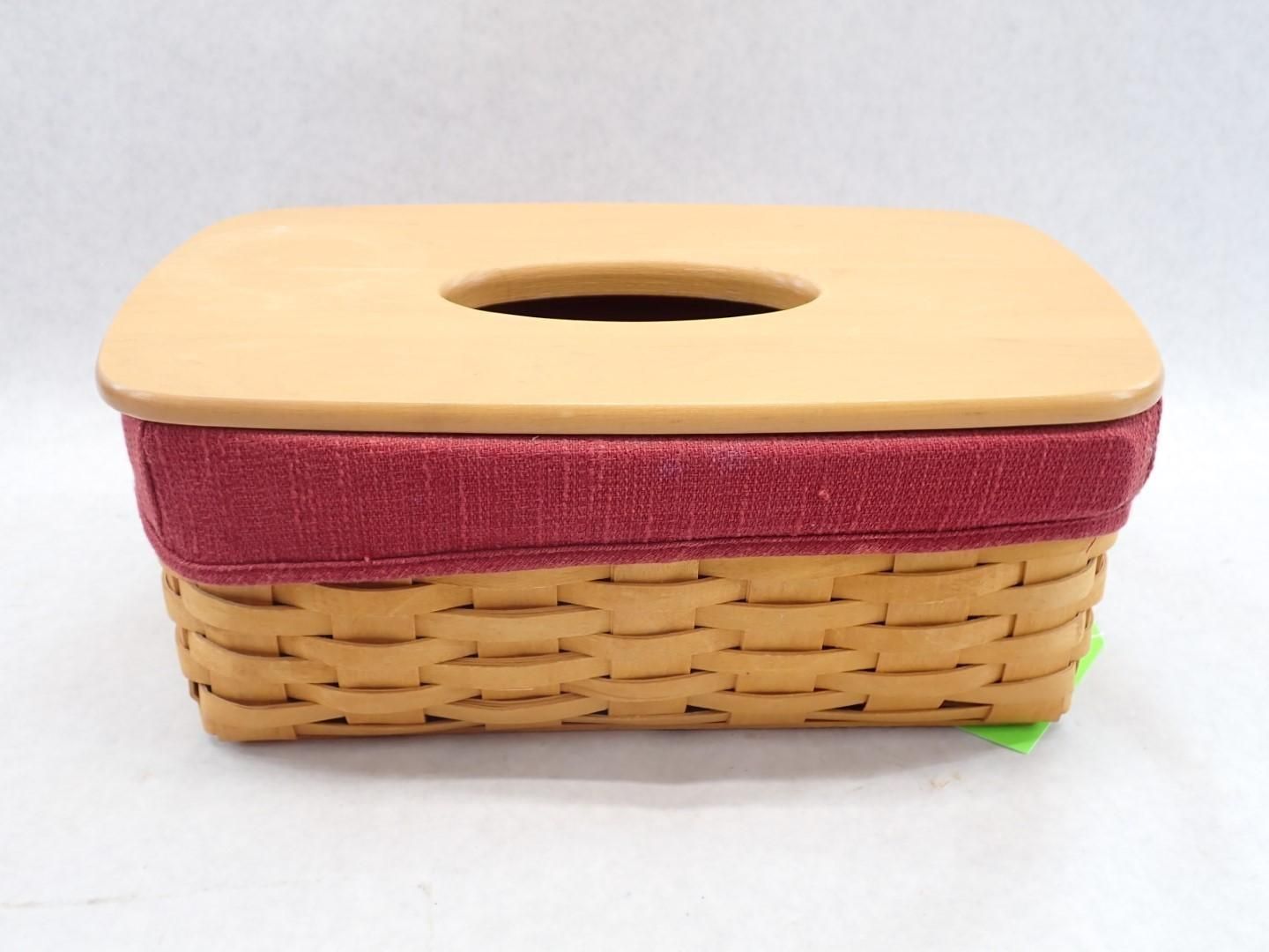 Basket tissue box with tan woven sides, burgundy fabric band, and tan lid with circular opening.