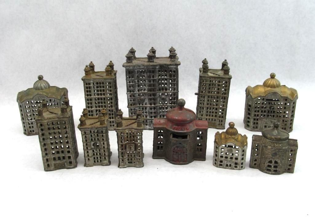 Collection of small, antique metal buildings in various styles.